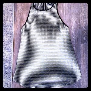 Tunic length tank top with back supper closure.